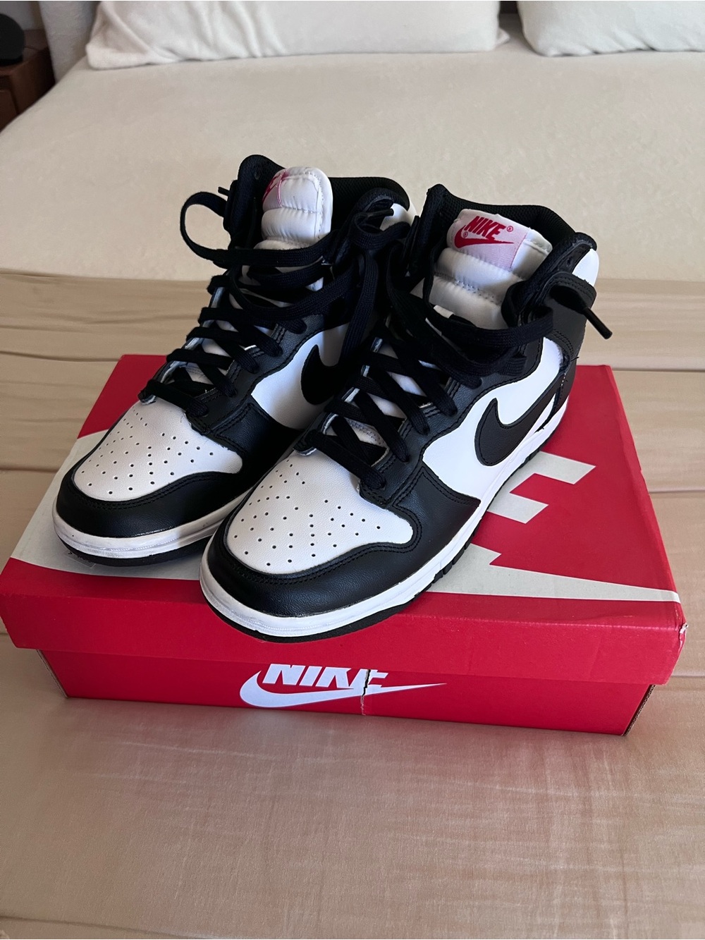 Nike Black and White Mid-Top Sneakers with Pink Tongue Logo